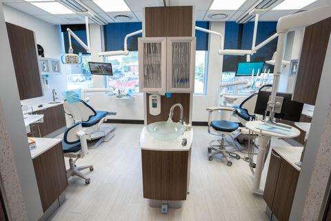 Modern dental treatment room with patient chairs
