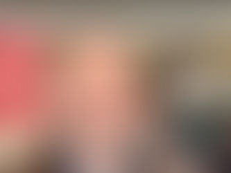 A person stands outside McCourt Law Offices, with a red exterior and snow on the ground. A black car is parked nearby.