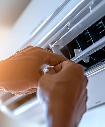Professional technician inspecting and replacing air conditioning filters