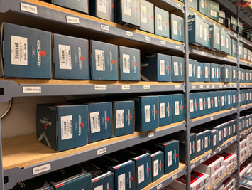 Shelves displaying boxed automotive components for quick inventory access