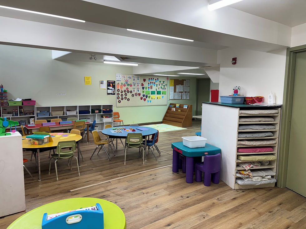 A lively classroom filled with bright, colorful tables and chairs