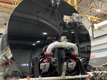 Commercial tanker trailer undergoing repair in heavy-duty service workshop