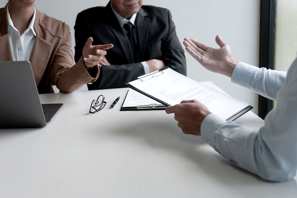 Three persons are discussing reports