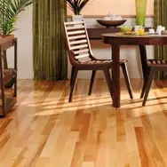 Newly laid floor with chairs, table and cabinet on top