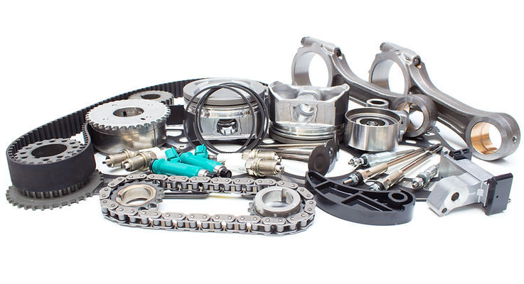 Collection of engine components including pistons and belts