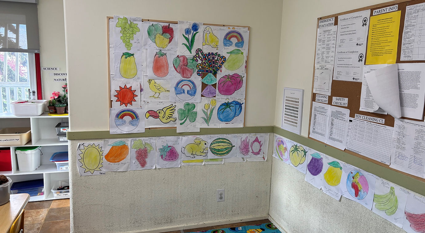 An interior view of a classroom showcasing a bulletin board and a cozy rug
