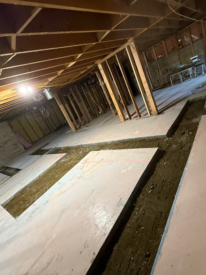 Concrete slab sections prepared inside a wooden framed structure