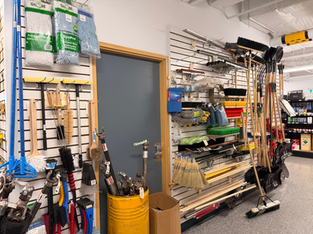 Cleaning tools and shop equipment displayed inside Veg Auto store