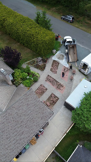 Aerial view of a yard excavation and concrete project site