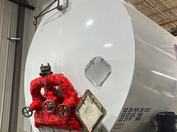 Fuel tanker trailer receiving professional maintenance inside Veg Auto service facility