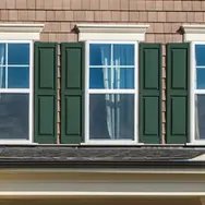 Sliding windows with green coloured doors