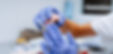 Close up of prosthetic's hands while working on the denture