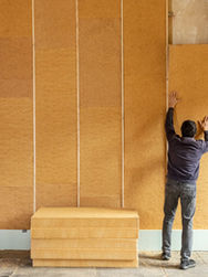 A person working on the insulation of a house
