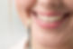 Dental technician determines color for a denture directly on a woman's mouth