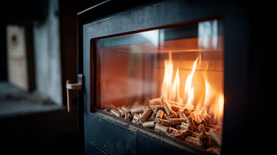 Cozy warm glow viewed through glass window of pellet stove with flickering flames