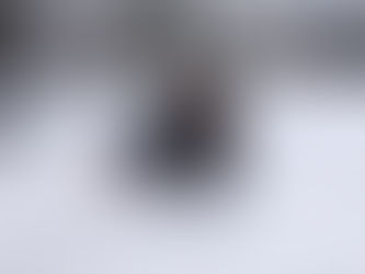 Woman fallen on icy pavement in park