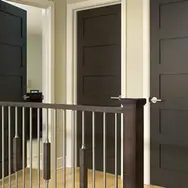 Three dark brown coloured doors