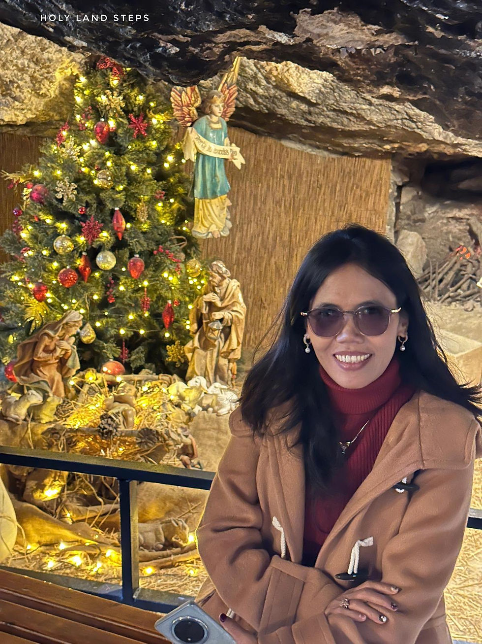 A pilgrim sitting in one of the natural caves that once served the shepherds in the time of Jesus.