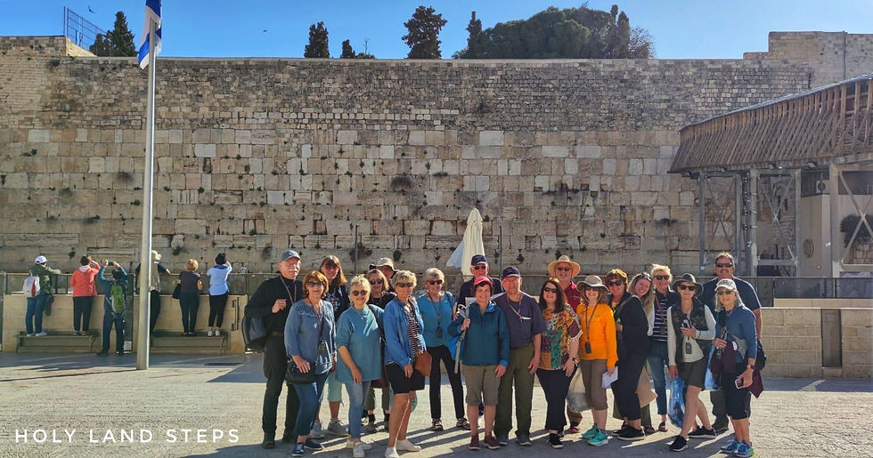 A group enjoying a visit to the Western Wall in Jerusalem.