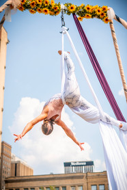 Aerial Silk Artist Upside With Arms Open