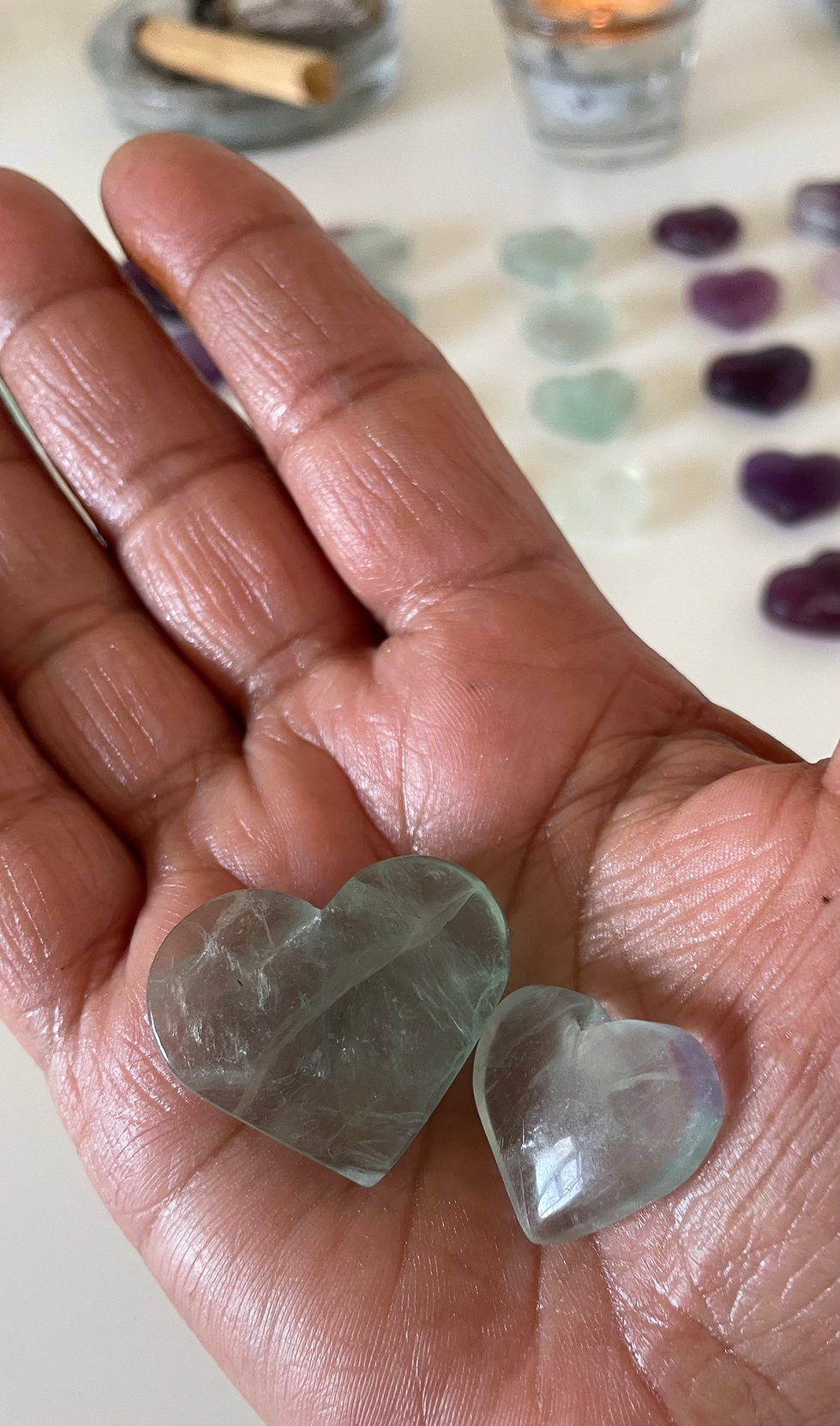 Thumbnail: hand holding a crystal fluorite heart