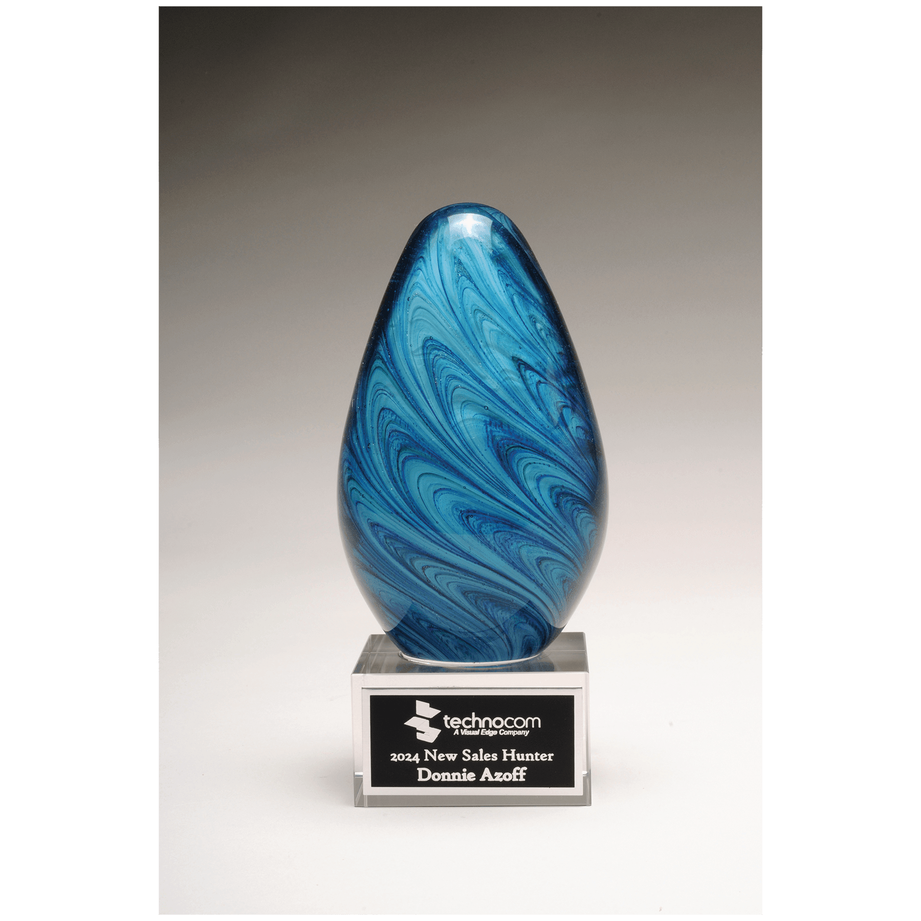 6 1/4" Blue and Green Egg Shaped Art Glass on Clear Glass Base with Black Lasera