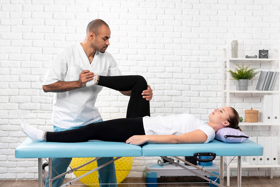 male-physiotherapist-checking-woman-s-leg.jpg
