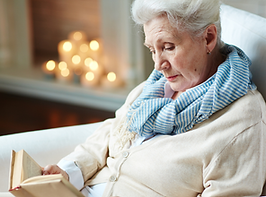 Older woman reading a book