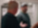 Paul discussing items with a client