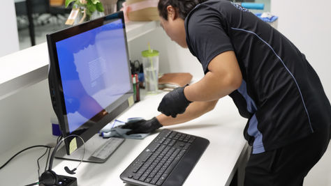 In-Tec cleaner wiping desk