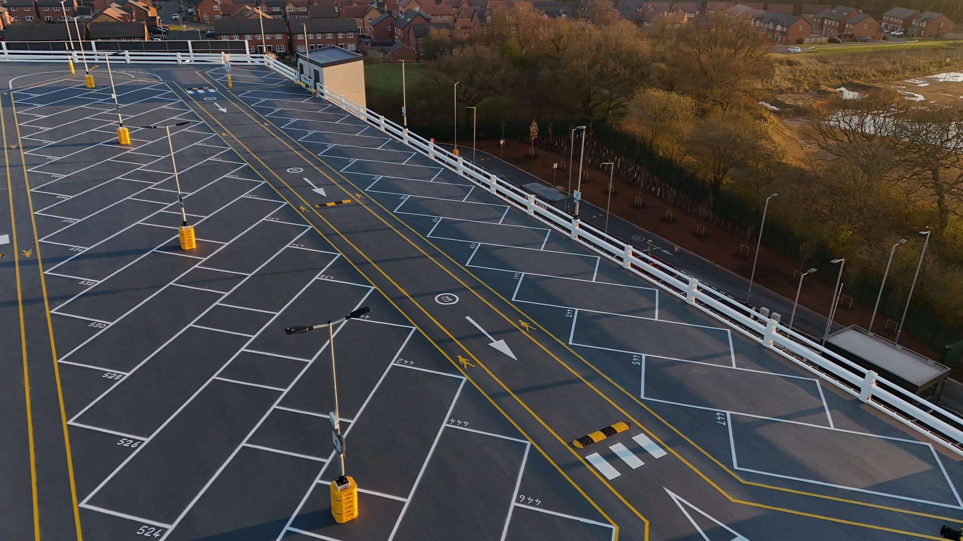 Long shot view of the top deck of a car park
