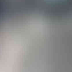 Steel beam under floor that has been ground down.