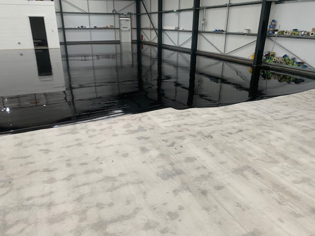 Floor half painted with half just concrete