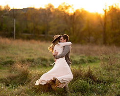 golden-field-couples-hug-sunset.jpg