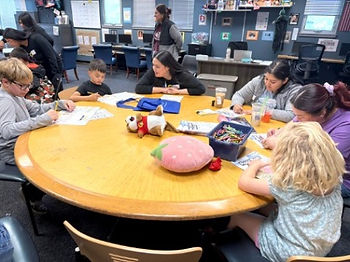 Credit Union employee volunteering with kids