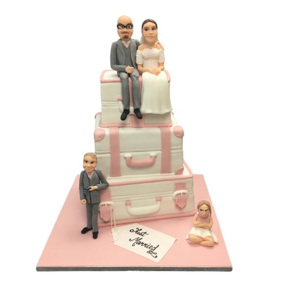 Three-tier suitcase wedding cake with sugar paste figurines and pink accents.