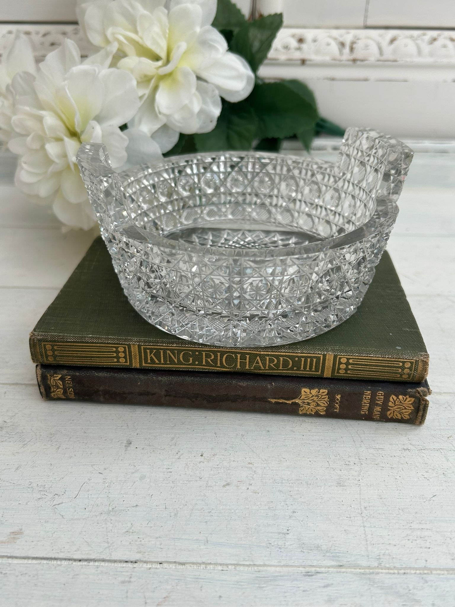Antique American Brilliant Period cut glass bowl on books