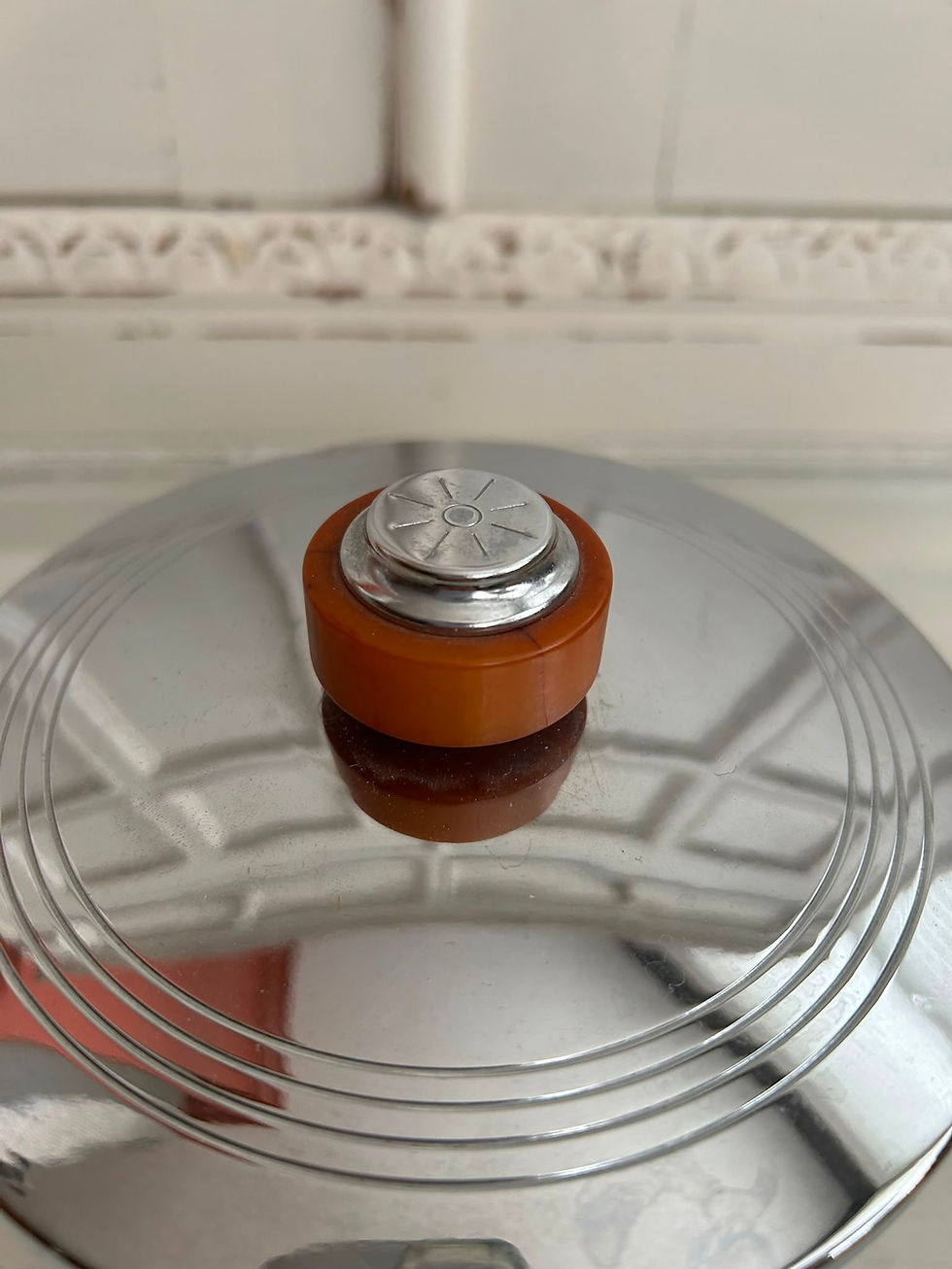 Thumbnail: Lid of a vintage red and gold glass ice bucket.