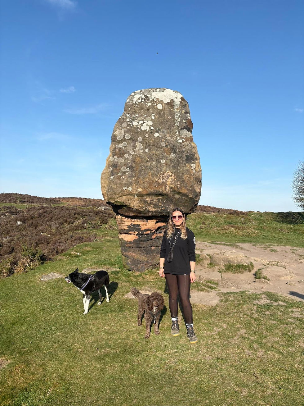 Becci the volunteer with two dogs
