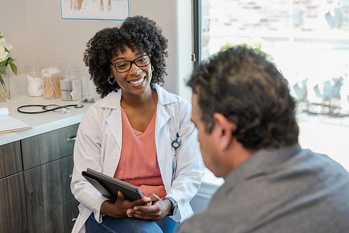provider pink shirt patient in clinic doctor.jpg