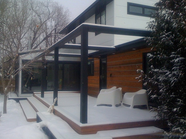 Contemporary exterior. Large deck. Large pergola. Cedar siding. Metal flashing detail.