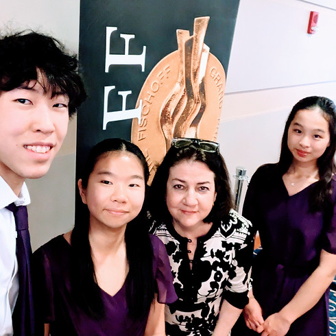 Sarah Plum with 3 students after a perfomance