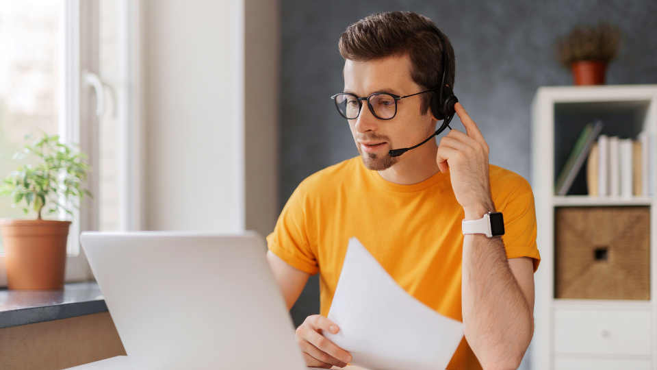 An employee working remotely from her home office.