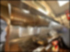 Commercial restaurant kitchen with ten foot stainless steal hood sold by Jimmy Carey Commercial Real Estate
