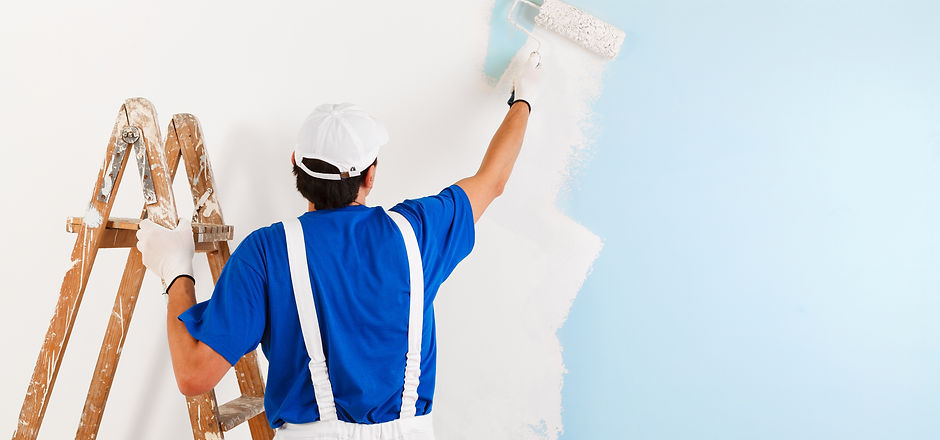 Back view of painter with cap and glove