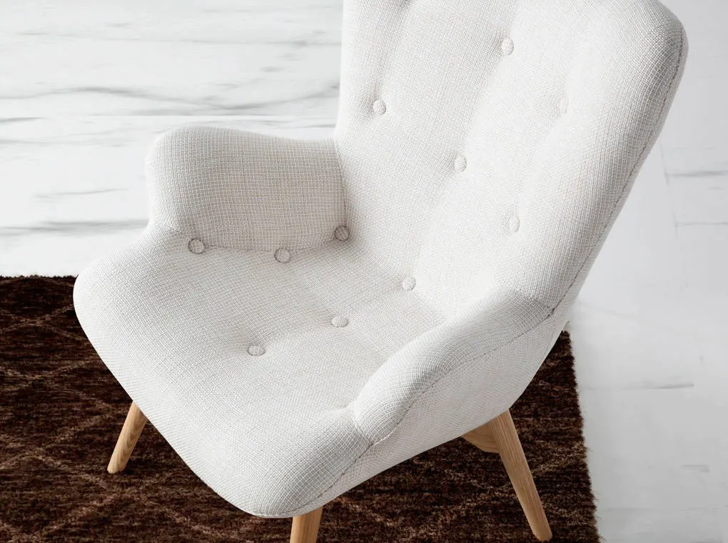 Fauteuil rembourré en tissu beige