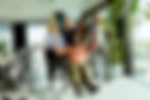 vecteezy_joyful-office-colleagues-engage-in-a-playful-chair-race-on-a_43242636.jpg