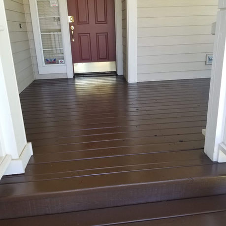 Tan siding, white trim, and chocolate brown porch. Smooth finish.