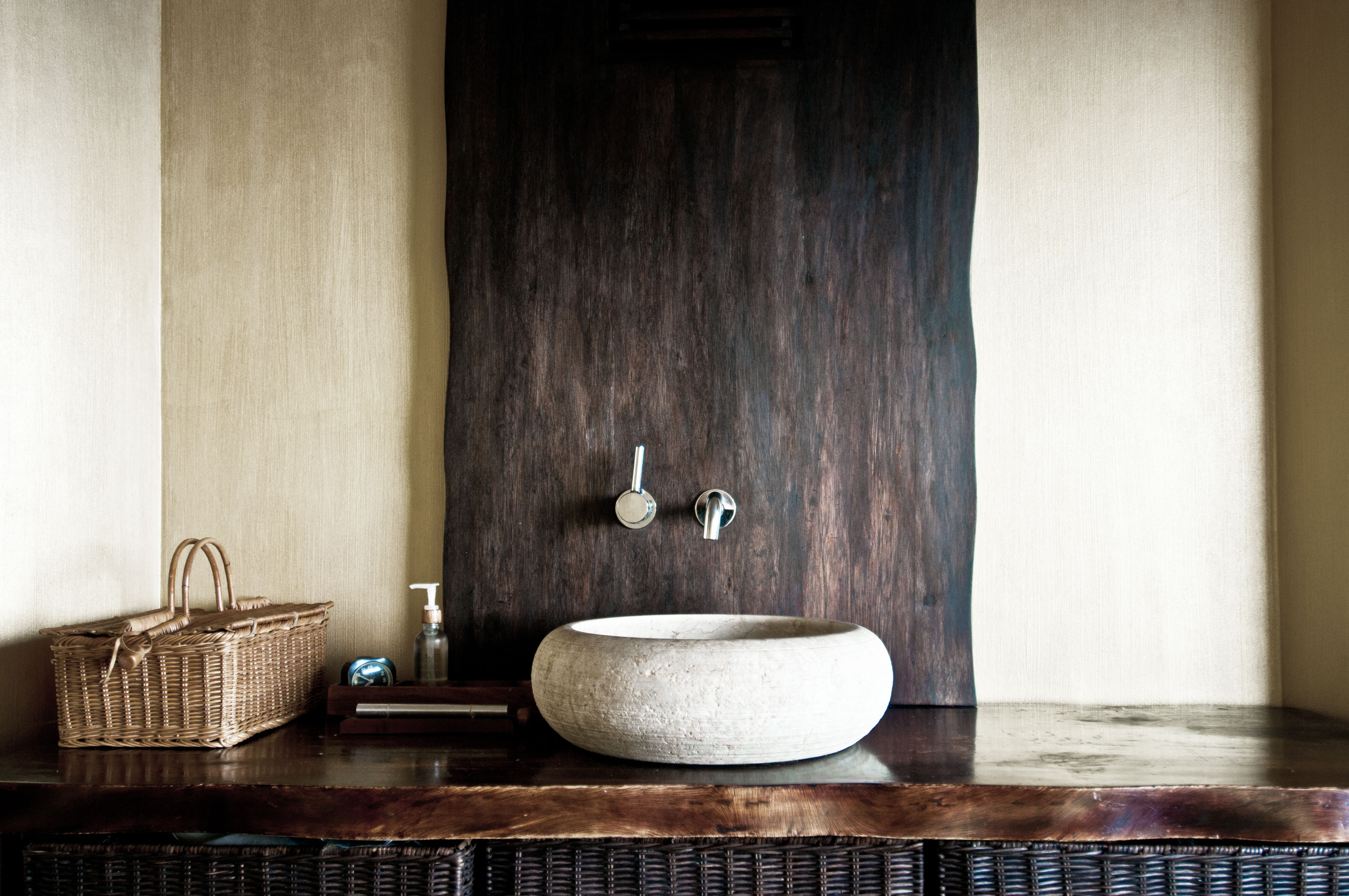 Modern organic bathroom vanity with stone vessel sink and live-edge vanity countertop