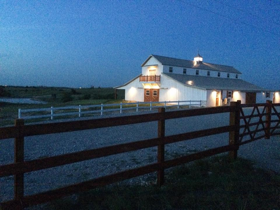 the big white barn at dusk